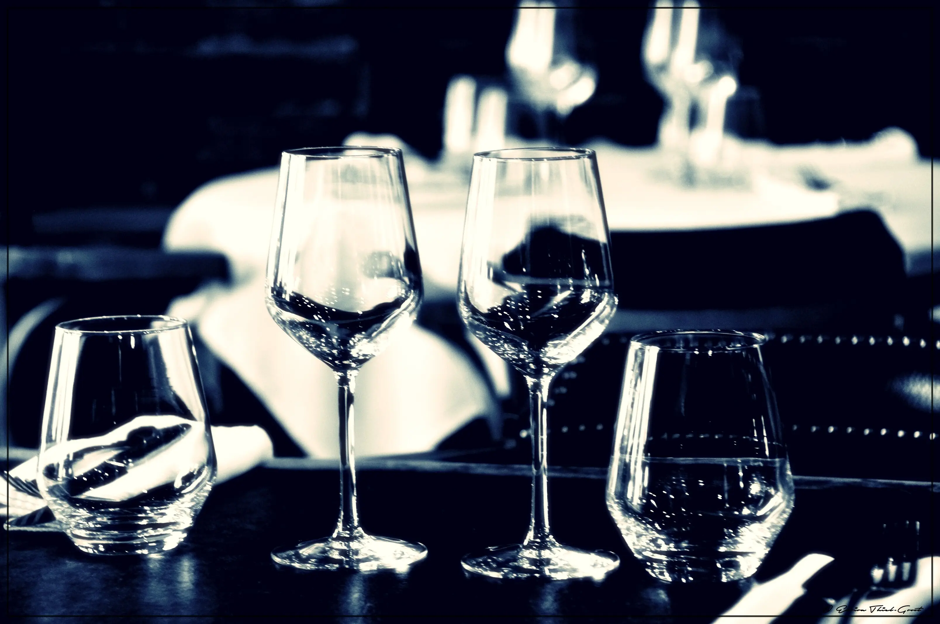 Close-up view of wine glasses on a table